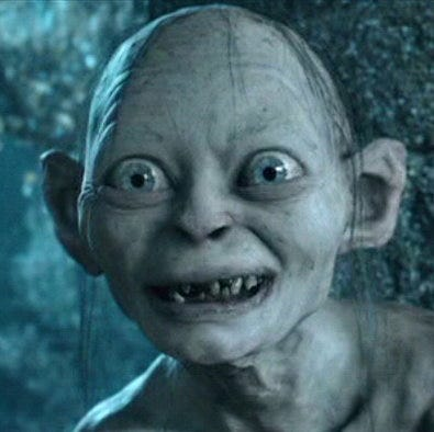 Gollum's pale hungry face